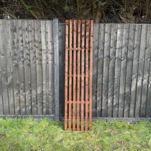 6ft x 2ft slatted vertical trellis fence panel in garden setting