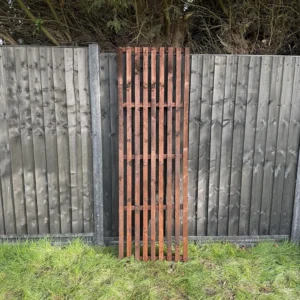 6ft x 2ft slatted vertical trellis fence panel in garden setting